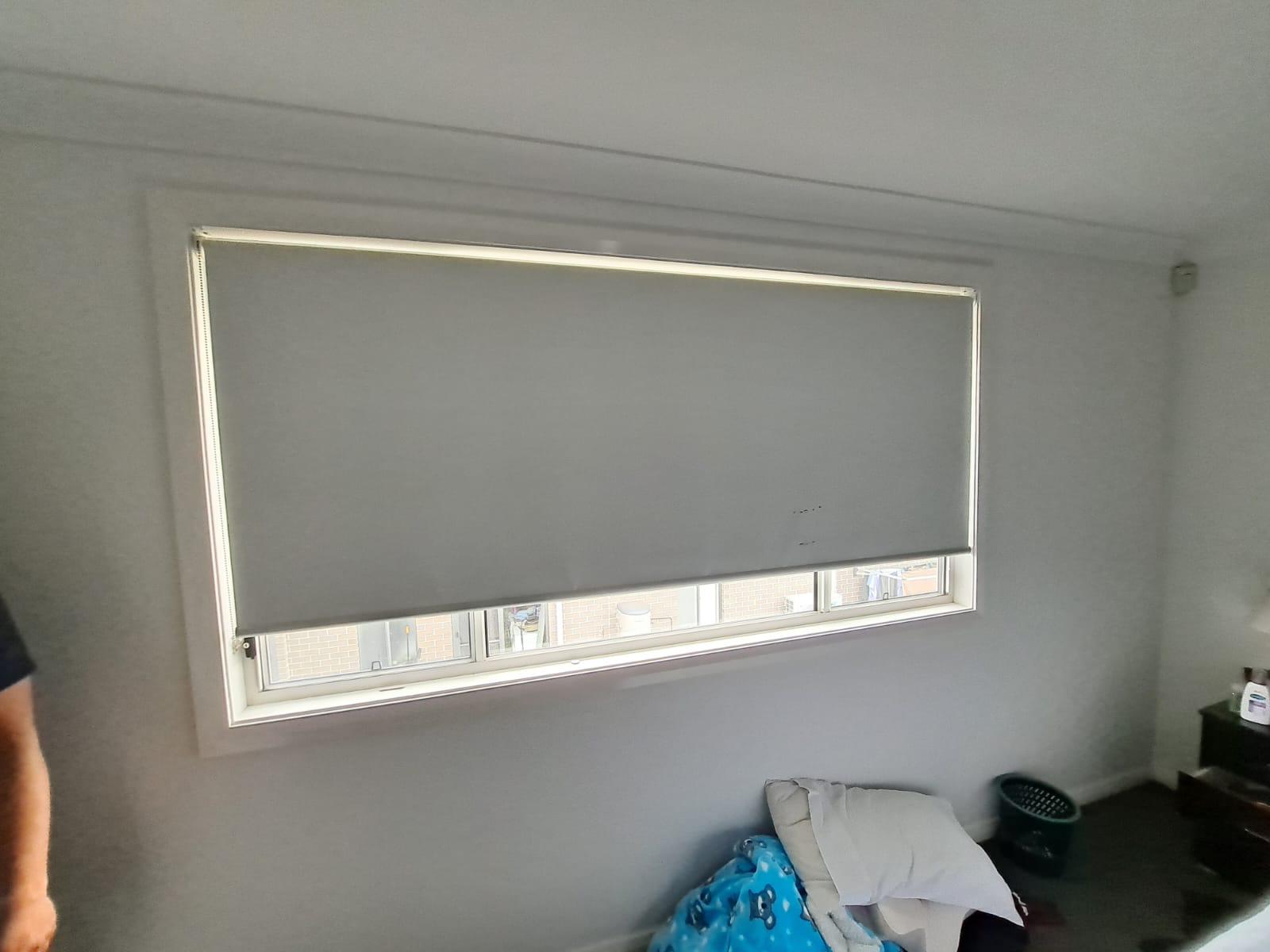 Bedroom blockout roller blind in soft charcoal